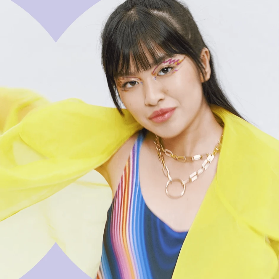 Fashion and beauty campaign portrait featuring model with colourful makeup and vibrant styling