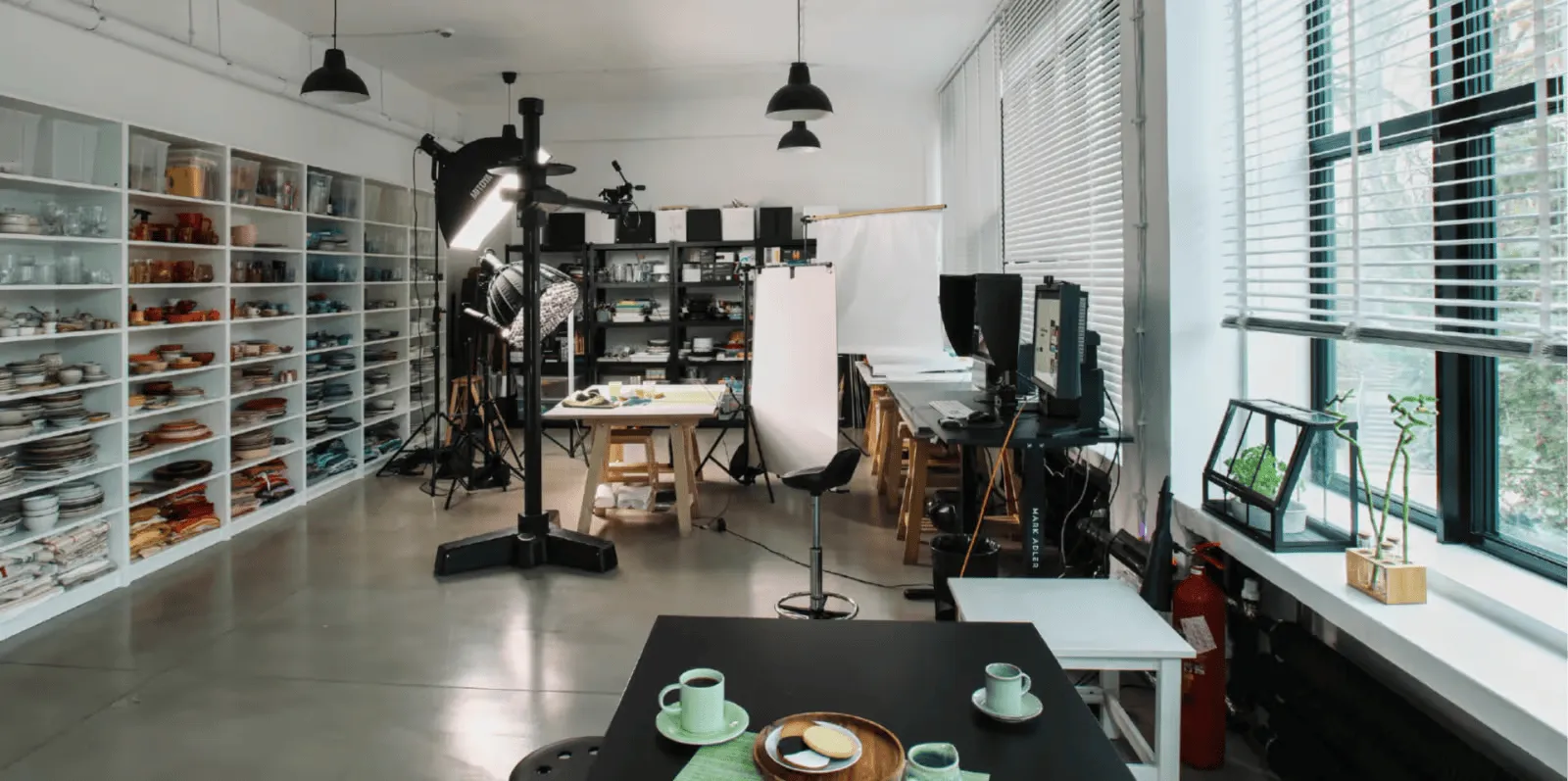 Professional photography studio in Warsaw with lighting equipment, styling props, and workspace setup